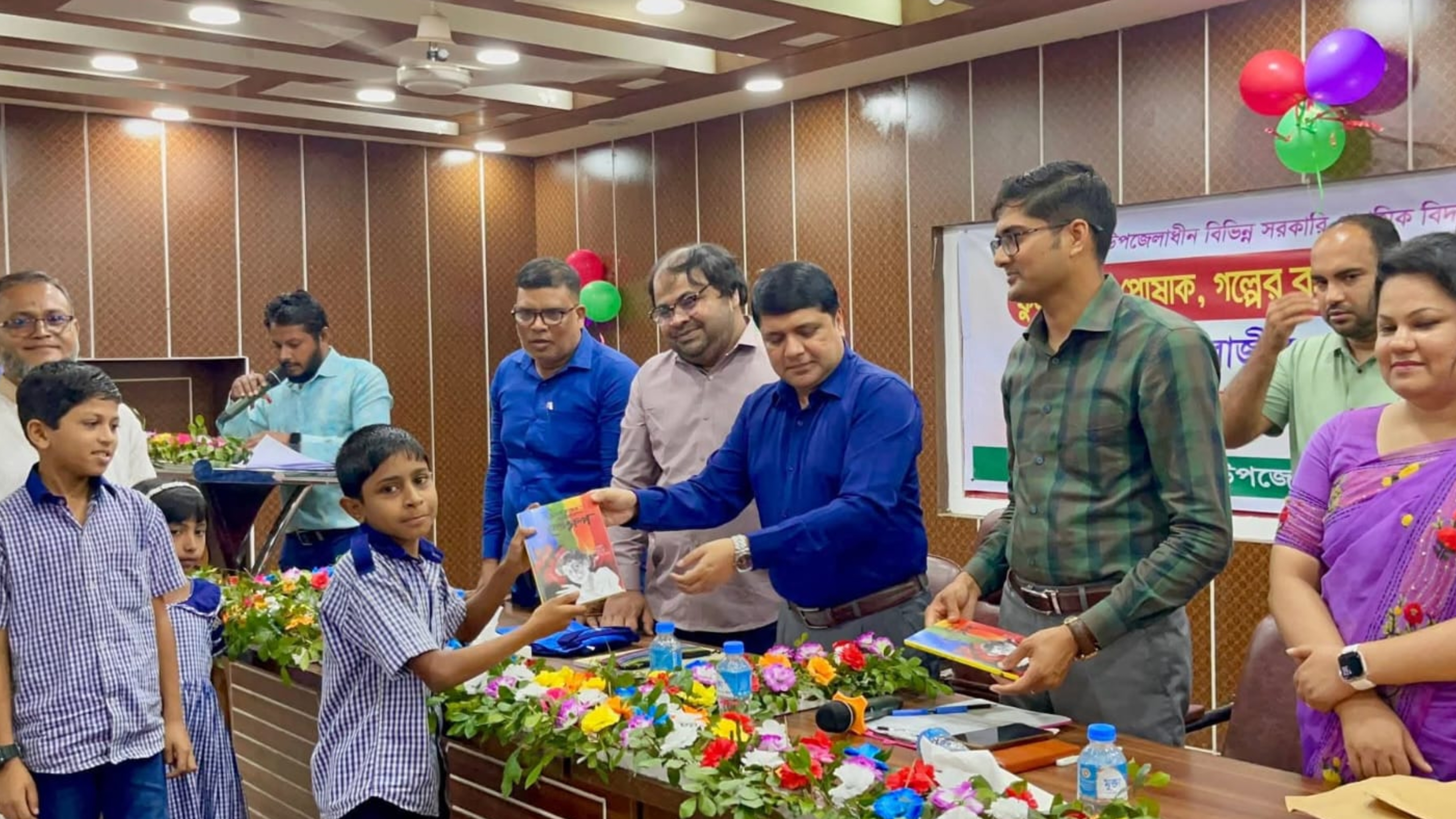 রায়পুরে শিক্ষার্থীদের মাঝে বইসহ উপকরণ ও প্রতিবন্ধীদের হুইল চেয়ার বিতরণ