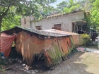 দুর্গন্ধের প্রতিবাদ করায় নারী ও শিশুকে পিটিয়ে জখম